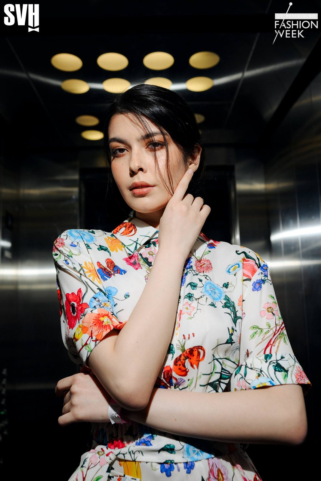 Backstage portrait: warm bronze eyes, peach lips, floral shirt