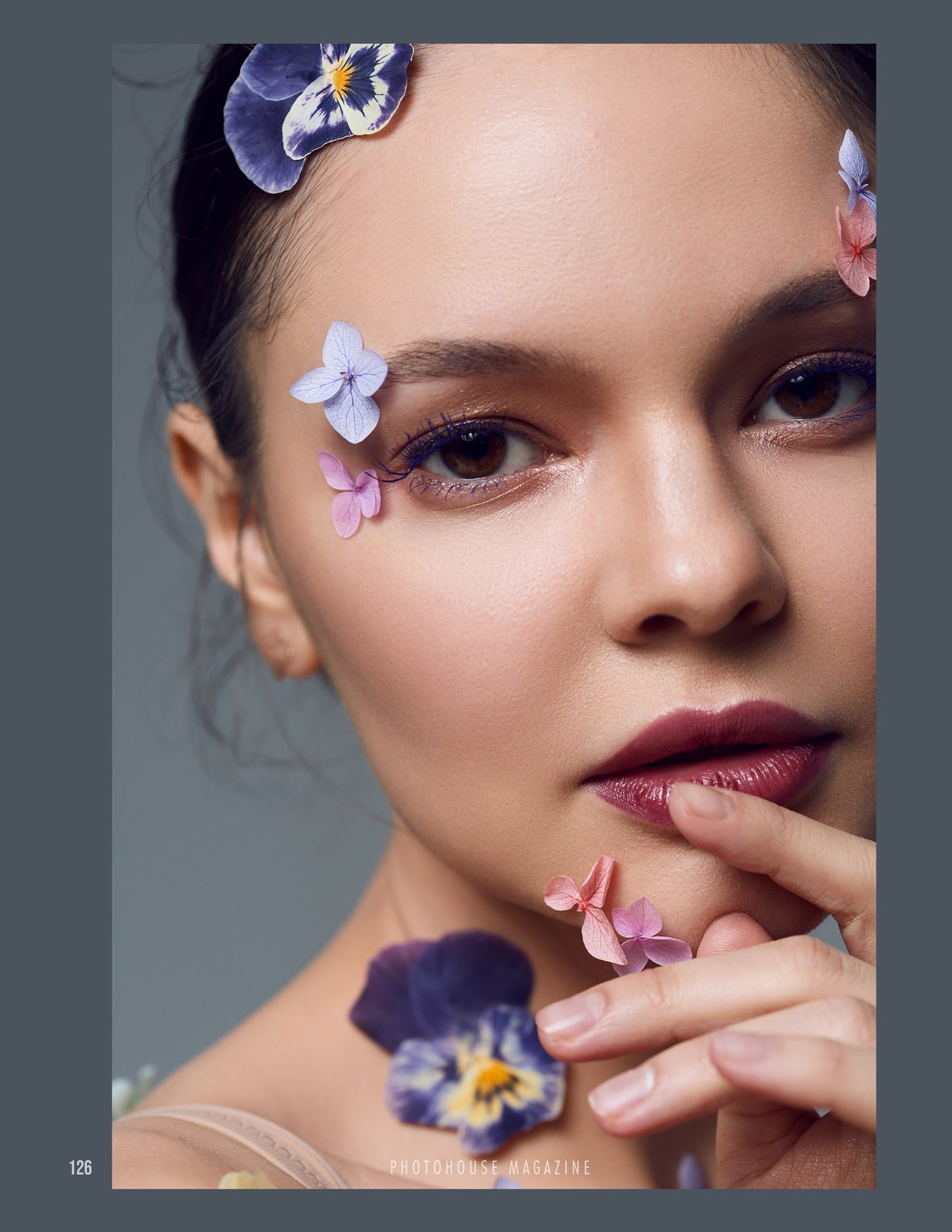 Beauty portrait with petals on the skin